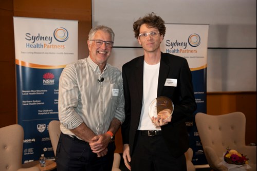 Dr Jonathan Williams accepting the award on behalf of Dr Kylie Hunter